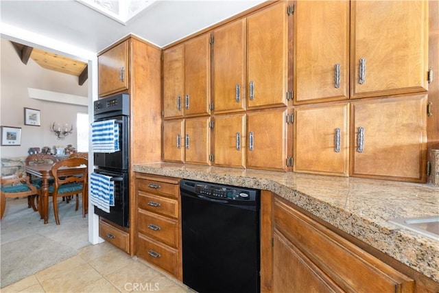 kitchen with beamed ceiling, light tile patterned floors, and black appliances