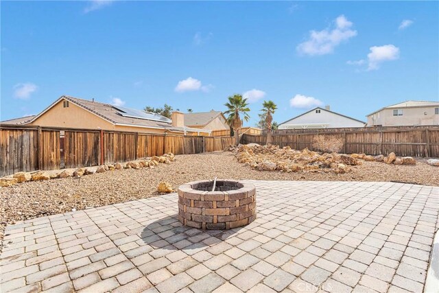 view of patio / terrace with an outdoor fire pit