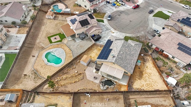 birds eye view of property with a residential view