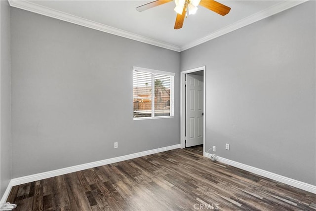 unfurnished room with crown molding, ceiling fan, dark wood-style flooring, and baseboards