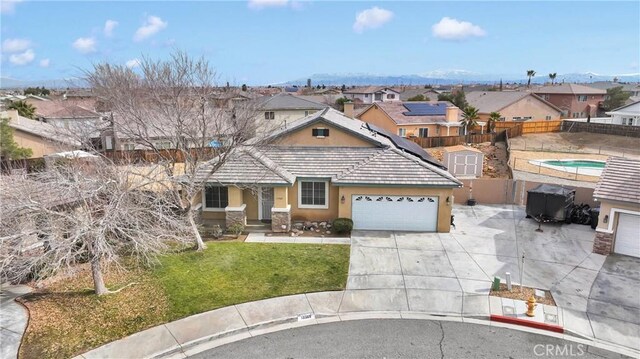 view of front of house featuring a garage and a front yard