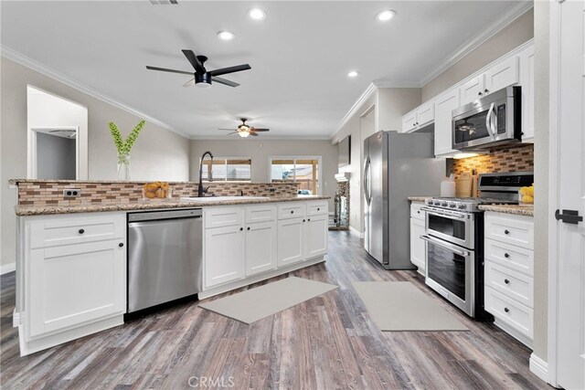 kitchen with white cabinetry, appliances with stainless steel finishes, and sink