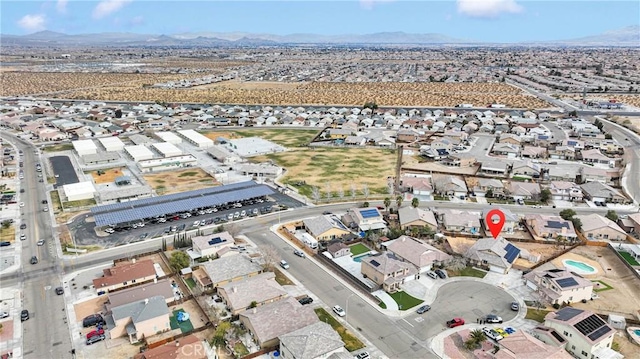 bird's eye view featuring a residential view and a mountain view