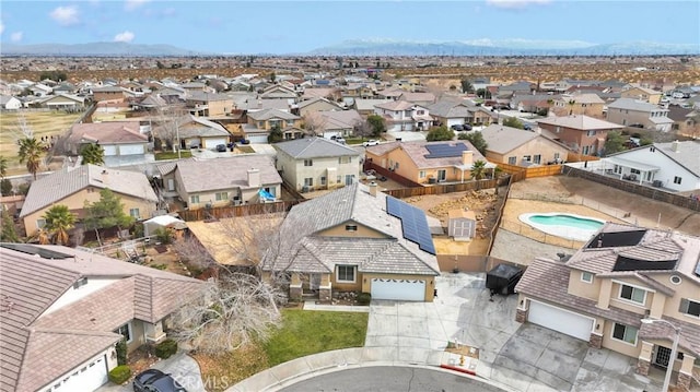 drone / aerial view featuring a mountain view and a residential view