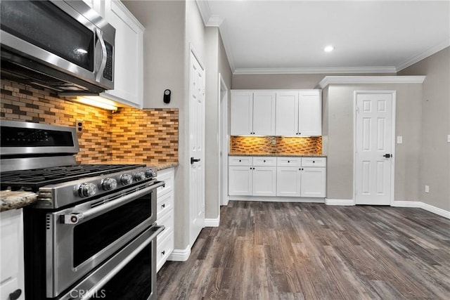 kitchen with crown molding, white cabinetry, appliances with stainless steel finishes, and light stone counters