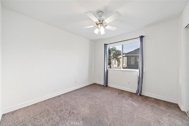 carpeted empty room with ceiling fan