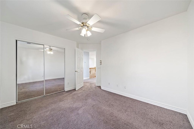 unfurnished bedroom with a closet, ceiling fan, and carpet