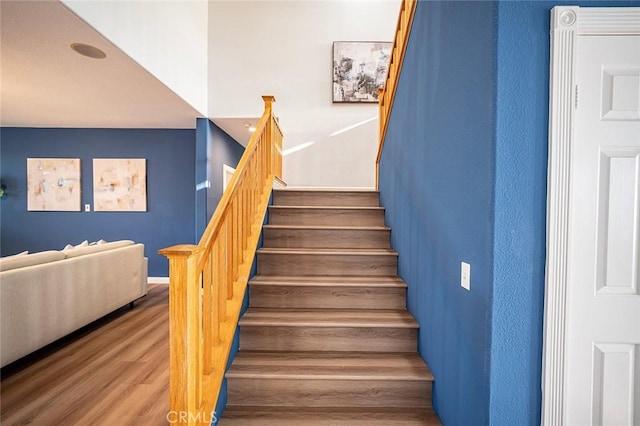 stairway featuring hardwood / wood-style floors