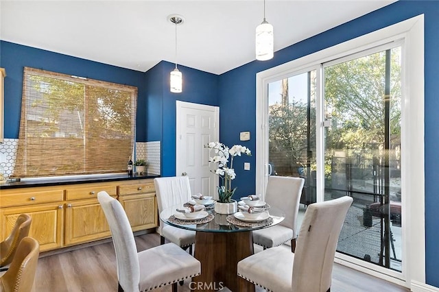 dining area with light hardwood / wood-style floors