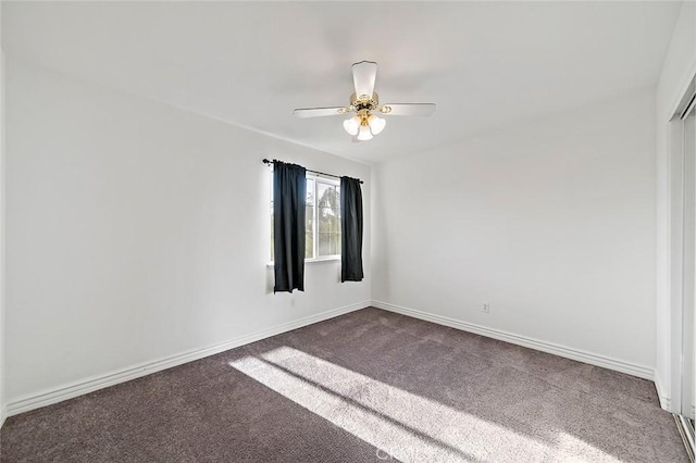 empty room with carpet flooring and ceiling fan