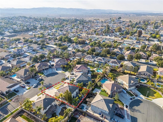 birds eye view of property with a mountain view