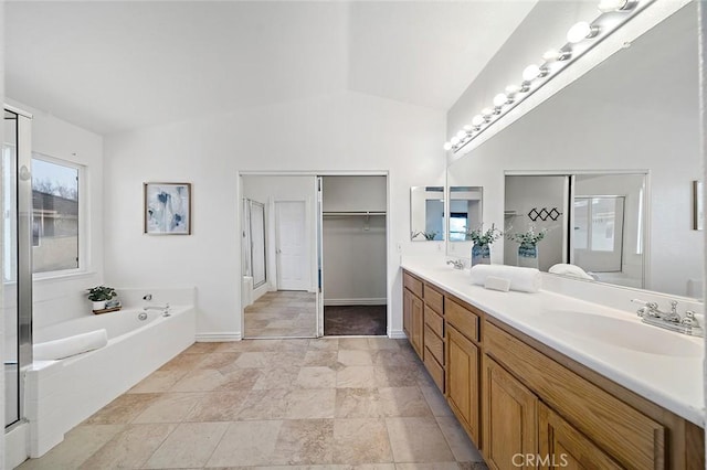 bathroom featuring vanity, lofted ceiling, and plus walk in shower