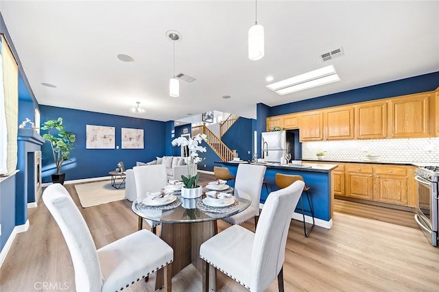 dining room featuring light hardwood / wood-style flooring