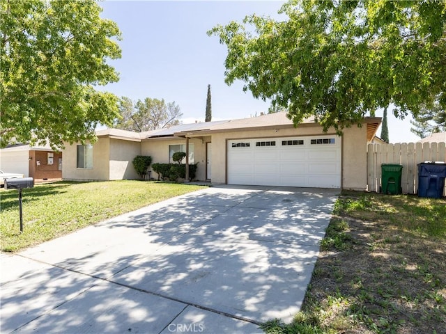 ranch-style home with a garage and a front yard