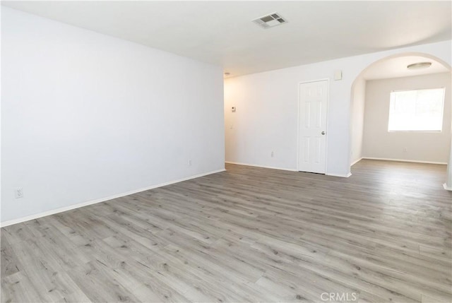 unfurnished room with light hardwood / wood-style floors