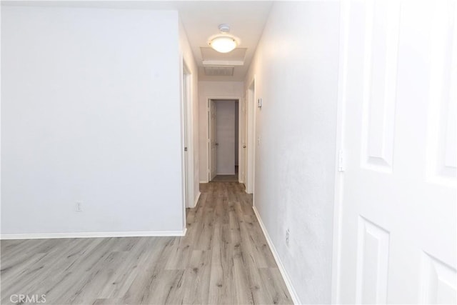 hall with light hardwood / wood-style floors