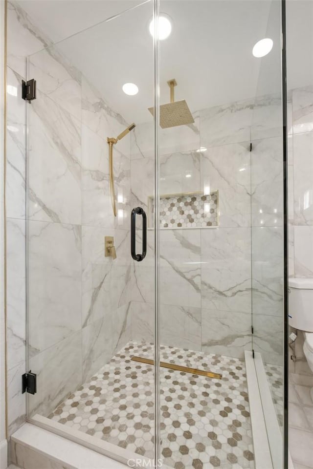 bathroom featuring an enclosed shower