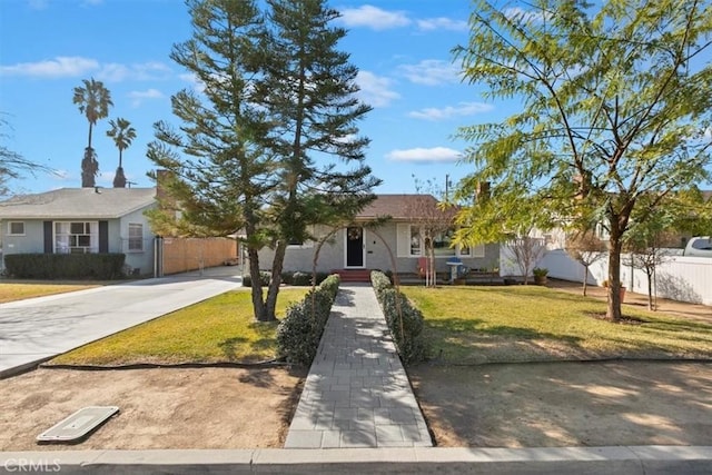 ranch-style home featuring a front yard