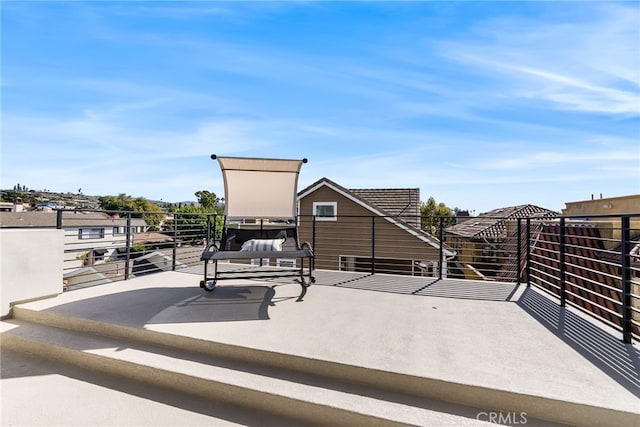 view of patio featuring a balcony