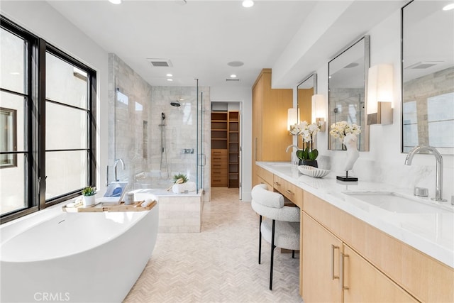 bathroom featuring vanity and separate shower and tub