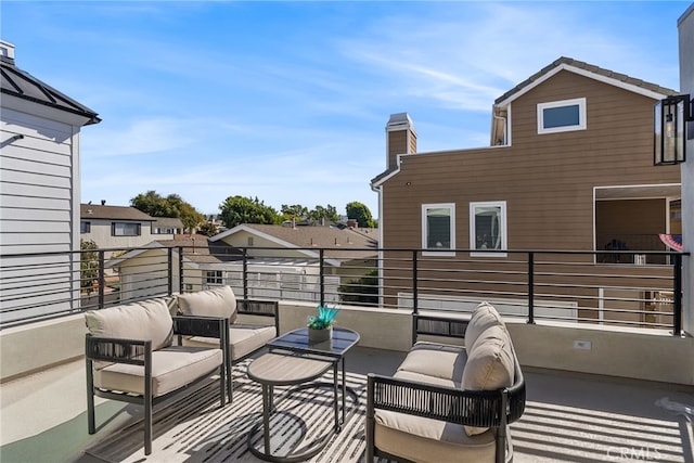 view of patio featuring a balcony and outdoor lounge area