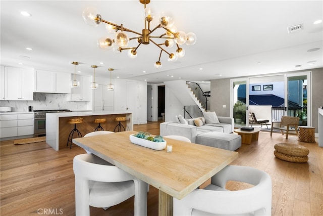 dining area featuring recessed lighting, visible vents, stairway, and light wood finished floors