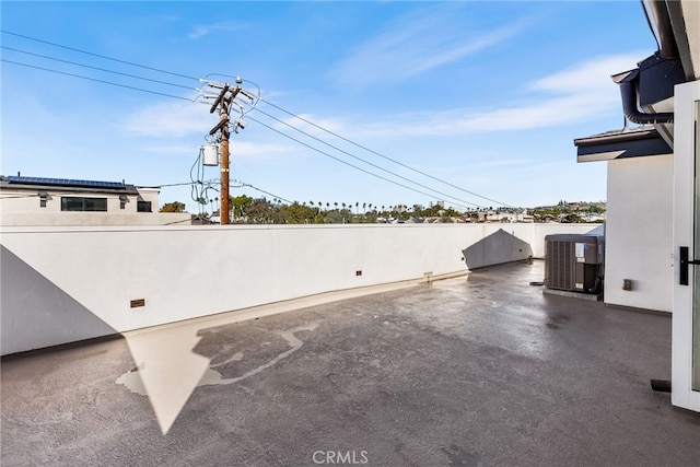 view of patio / terrace featuring fence and central AC