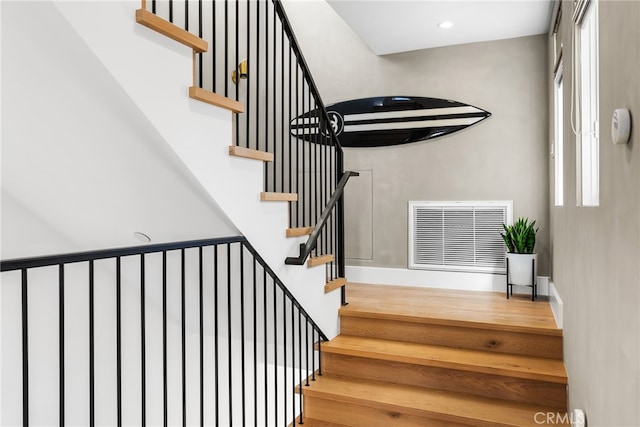 stairway with visible vents and recessed lighting