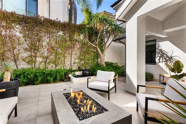 view of patio / terrace with a fire pit