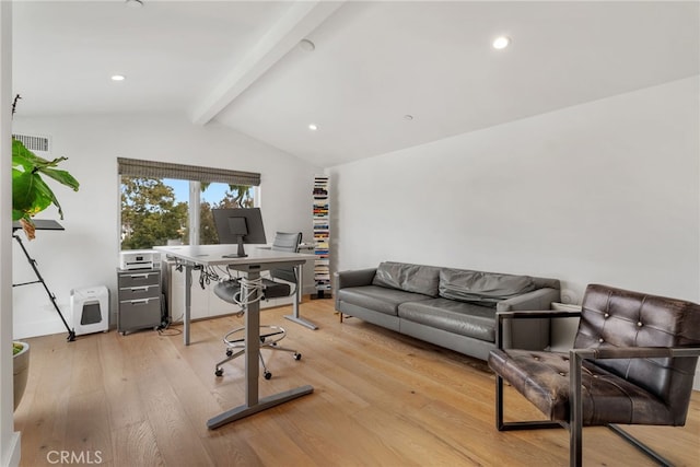 office space with light hardwood / wood-style flooring and vaulted ceiling with beams