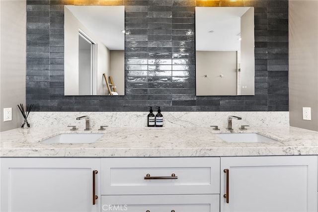 bathroom featuring double vanity, a sink, and decorative backsplash