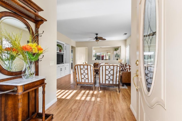 interior space featuring ceiling fan and light wood-type flooring