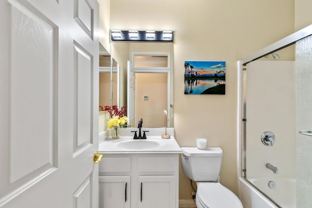 full bathroom with vanity, toilet, and combined bath / shower with glass door