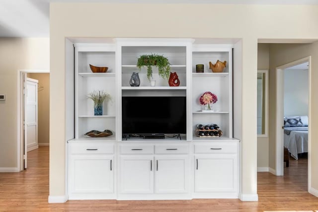 interior space featuring white cabinetry and light wood-type flooring