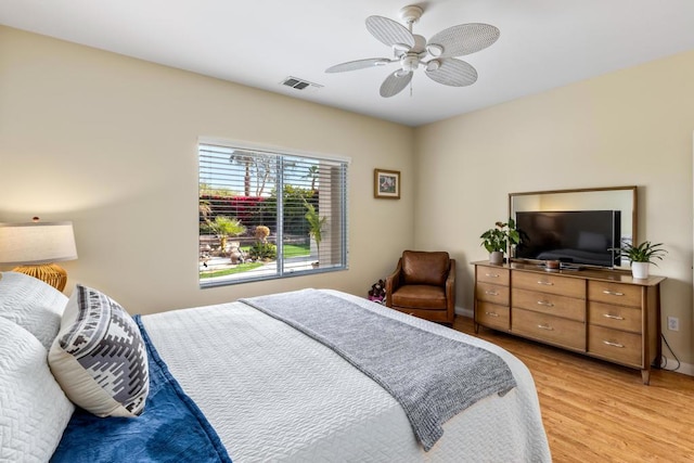 bedroom featuring ceiling fan and light hardwood / wood-style floors