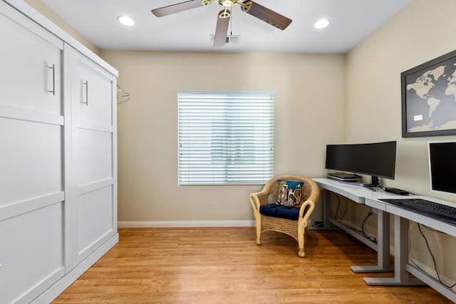 office area with ceiling fan and light hardwood / wood-style floors