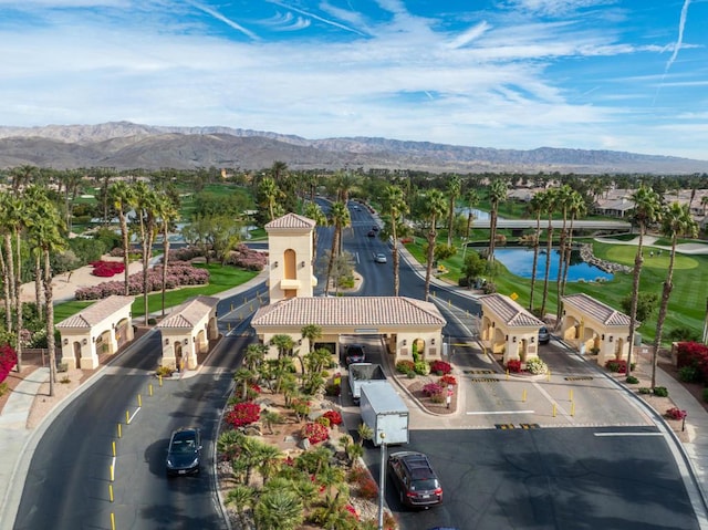 birds eye view of property featuring a water and mountain view