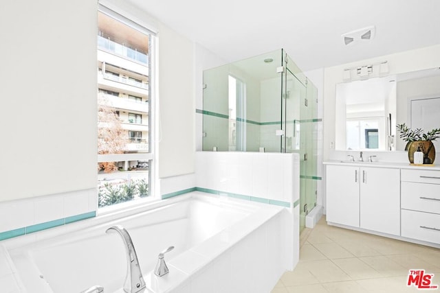 bathroom featuring vanity, tile patterned floors, and independent shower and bath