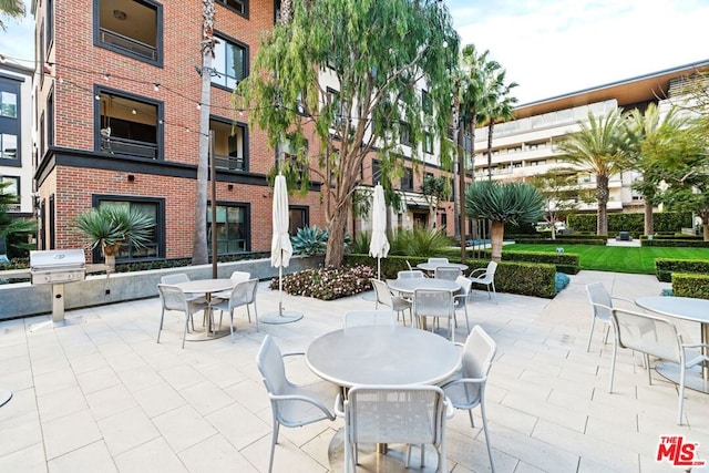 view of patio featuring exterior kitchen and grilling area