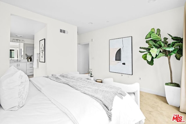 carpeted bedroom featuring sink