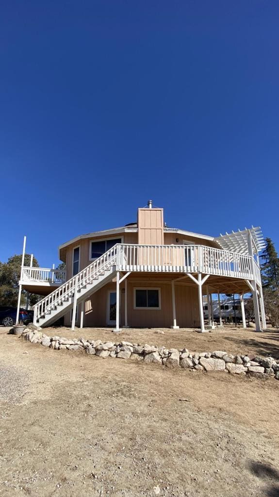 view of front of property with a wooden deck