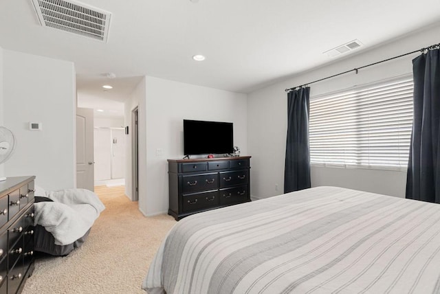 bedroom with light colored carpet