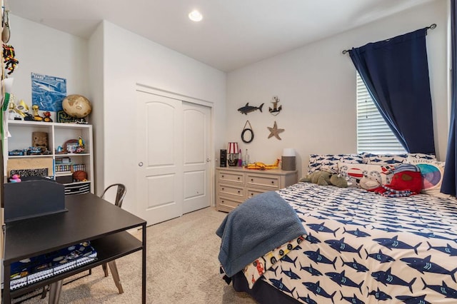 carpeted bedroom with a closet