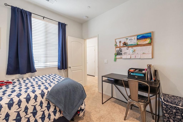 bedroom featuring light colored carpet