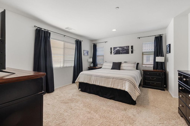 bedroom with light carpet