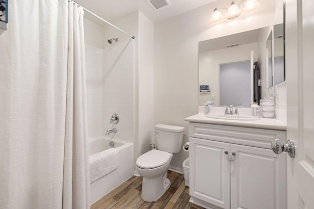 full bathroom with shower / bath combination with curtain, wood-type flooring, toilet, and vanity