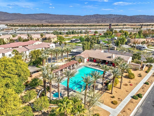 birds eye view of property with a mountain view