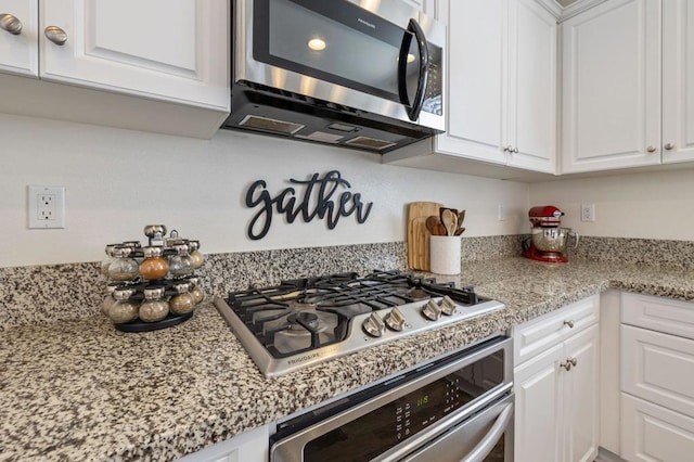 kitchen with white cabinetry and stainless steel appliances