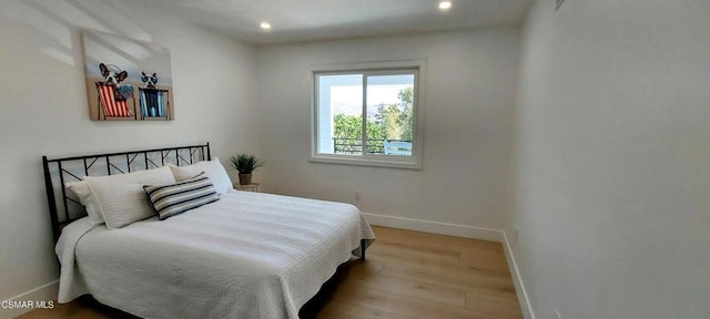 bedroom with light hardwood / wood-style flooring