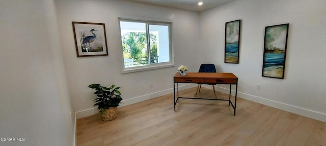 office area with light hardwood / wood-style flooring